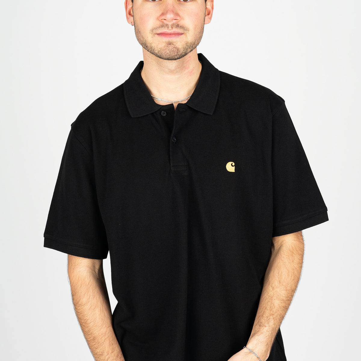 Chase Pique Carhartt WIP Polo-Shirt in black-gold für c – TITUS